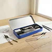 DOMS mathematical drawing instrument geometry box set on a wooden table